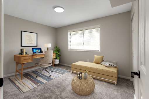 A bedroom with a bed, desk, chair, and window.