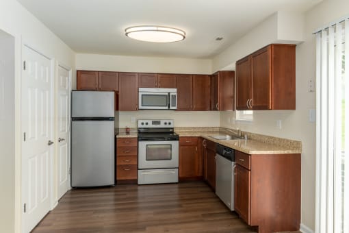 a kitchen with stainless steel appliances and a granite counter top