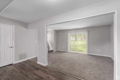 the living room and dining room of an apartment