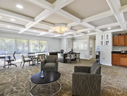 A spacious living room with a dining table and chairs.