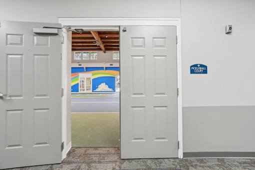 A white door with a sign that says