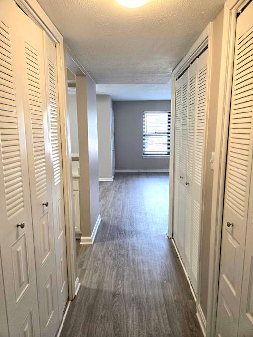 Closed white doors on either side of a hallway.