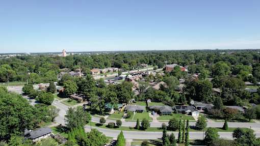 an aerial view of a neighborhood with houses and trees