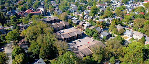 an aerial view of a neighborhood with houses and trees