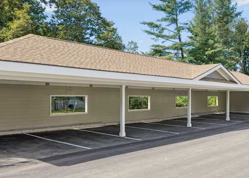 A parking lot with a building in the background.
