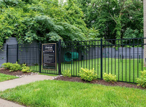 A black fence with a sign that says "Aquatic" on it.