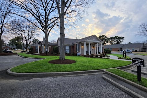 A sign in front of a house states that the property is reserved for future residents.