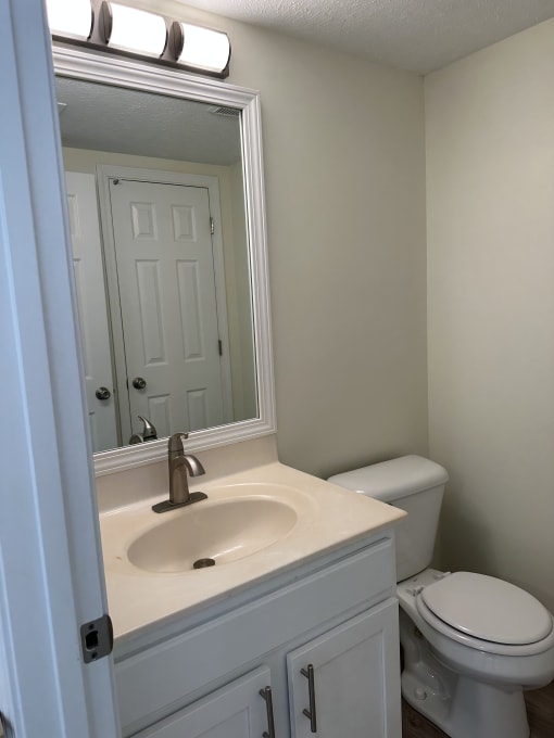 an overhead view of a bathroom with a sink and a toilet