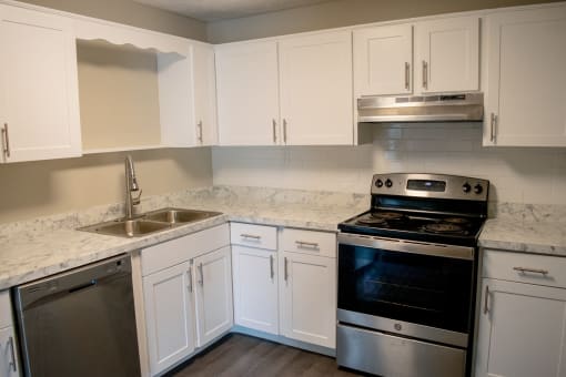 Renovated Kitchen featuring tile backsplash and stainless appliances