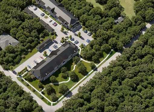 A bird's eye view of a residential area with houses and cars.