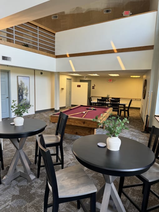 a view from the top of a staircase looking down into a living room with a