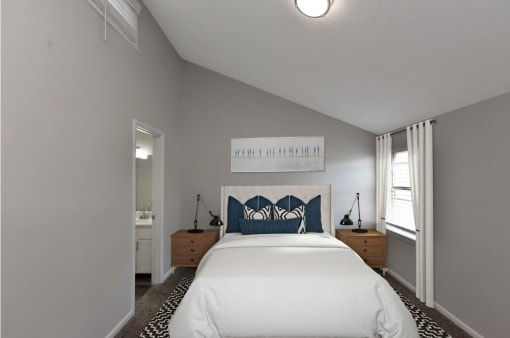 a bedroom with a large bed and a window