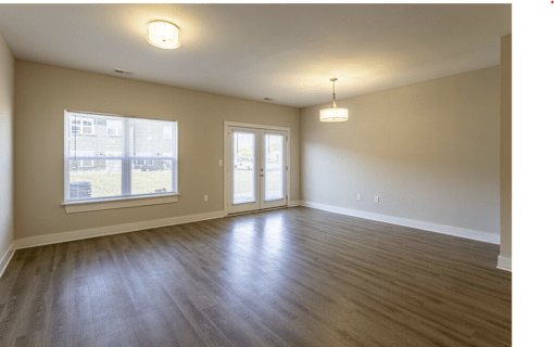 A room with a window and a door.