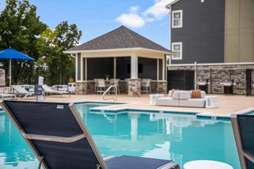 A pool with sun lounger