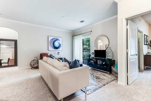 A living room with a white couch and a painting on the wall, Plantation Crossing, Lafayette, LA, 70508
