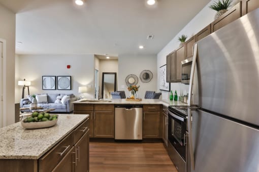 a kitchen with stainless steel appliances and granite counter tops  at Aventura at Hawk Ridge, Lake St Louis, MO, 63367