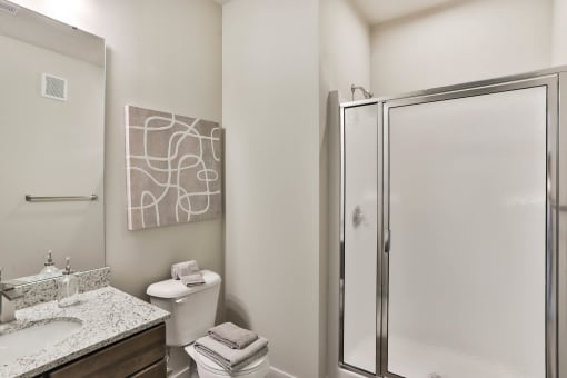 a bathroom with a shower and a sink and a toilet  at Aventura at Hawk Ridge, Lake St Louis