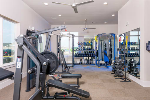 fitness center with equipment at The Edison at Madison, Madison