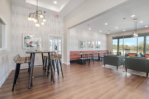A modern dining room with a wooden table and chairs.