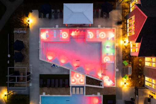 a birdseye view of a building with a neon sign on it  at The Edison at Tiffany Springs, Kansas City, Missouri