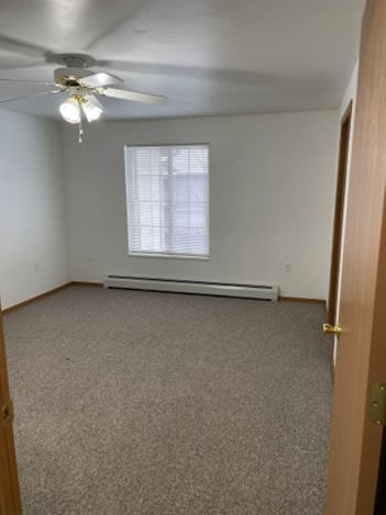 Bedroom with Window and Ceiling Fan