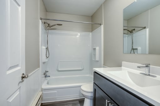 a bathroom with a toilet sink and bathtub