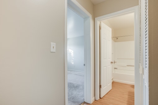 a bedroom with a closet and an open door