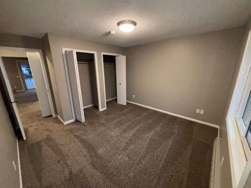 2-Bed Larger Bedroom 1 of 2