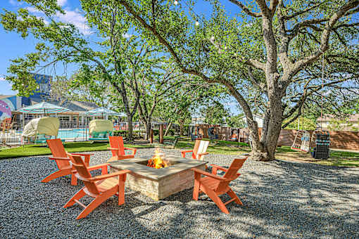 a patio with a fire pit and chairs around it at Peaks at Northwest Hills Apartments, Austin, Texas