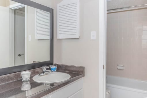 a bathroom with a sink and a mirror at The Escapade, Texas