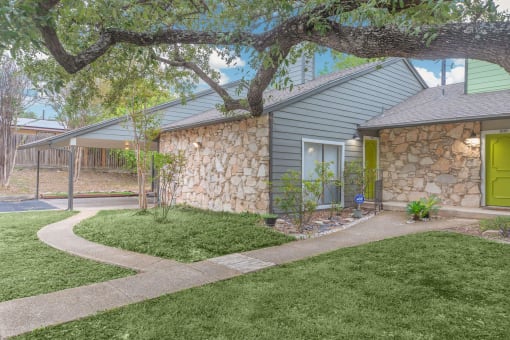 a side view of a house with a green door at The Escapade, Texas