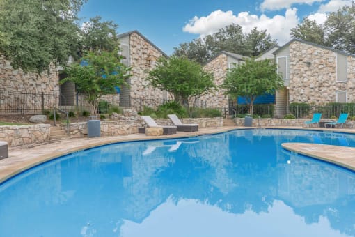 a swimming pool at a resort with a blue pool at The Escapade, Texas