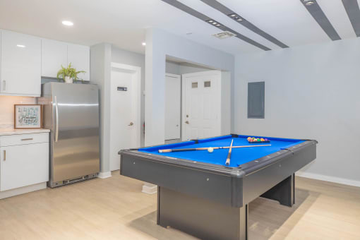 a games room with a pool table and a refrigerator at The Escapade, Texas