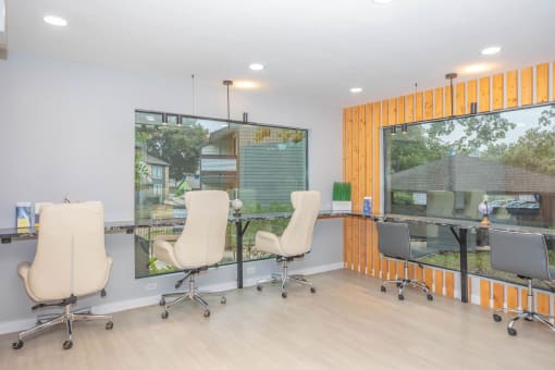 a room with chairs and a table and a window at The Escapade, San Antonio