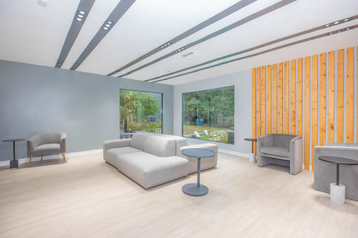 a living room with a couch and two chairs at The Escapade, San Antonio, 78216