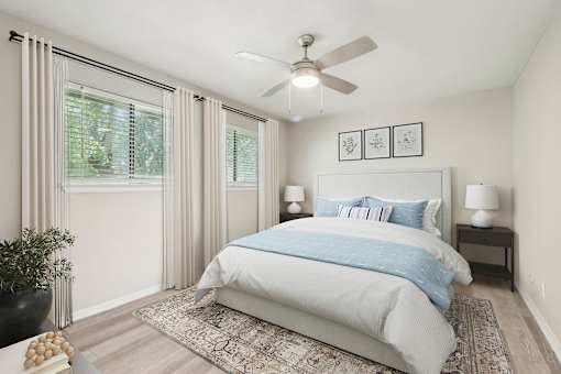 a bedroom with a bed and a ceiling fan at The Escapade, San Antonio, 78216