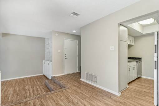 a kitchen and living room with a hard wood floor at The Escapade, San Antonio, TX
