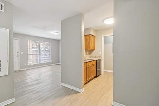 A kitchen area with wooden cabinets at Knoll Crest, San Antonio, Texas 78240