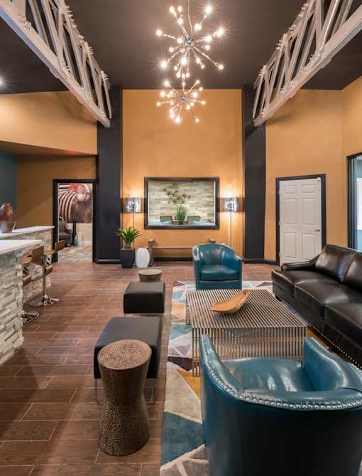 A modern living room with a black and white chandelier.