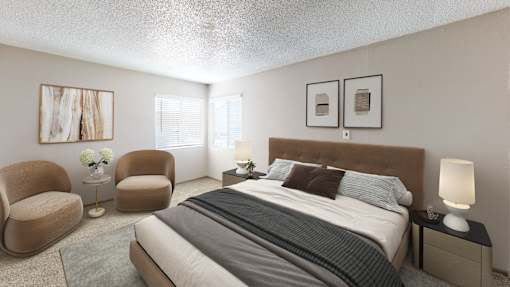A bedroom with a large bed, two chairs, and a nightstand.