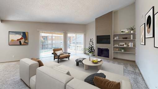 A living room with a white couch and a television.