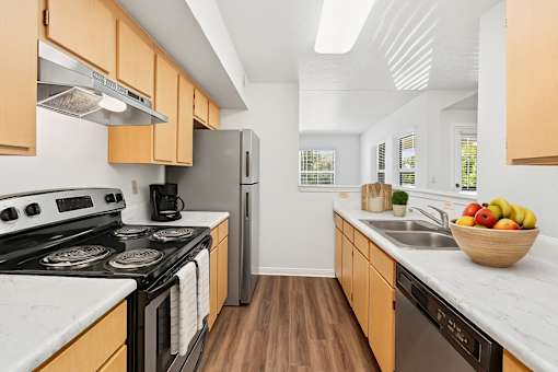 Kitchen with black stove top oven at Crosspoint Oaks at Boerne, Boerne, 78006