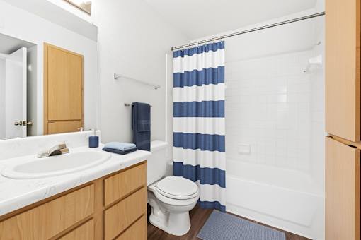 white sink with a wooden cabinet  at Crosspoint Oaks at Boerne, Boerne