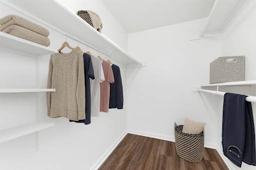white closet with clothes hanging  at Crosspoint Oaks at Boerne, Texas