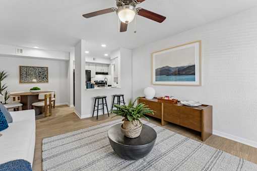 Open concept living room with kitchen view at Knoll Crest Apartments, San Antonio, TX