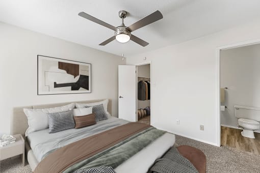 a bedroom with a large bed and a ceiling fan at The Hudson, North Richland Hills, 76180q