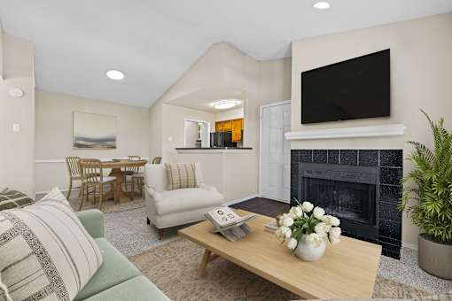 a living room with a fireplace and a television at Preston Bend, Dallas, Texas