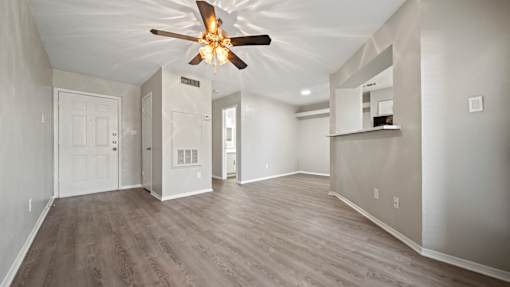 an empty living room with a ceiling fan at Polo Clubs Apartments, Austin, Texas