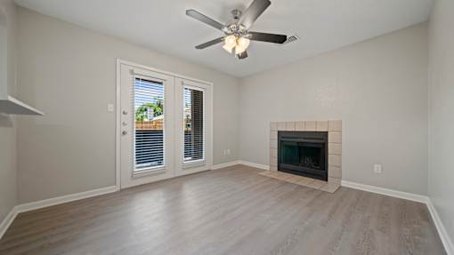 living room with a fireplace at Polo Clubs Apartments, Texas