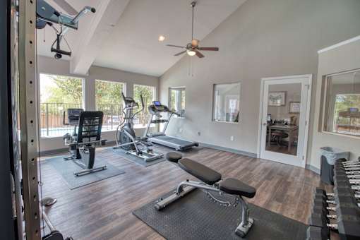 Gym with variety of equipments at Knoll Crest, San Antonio